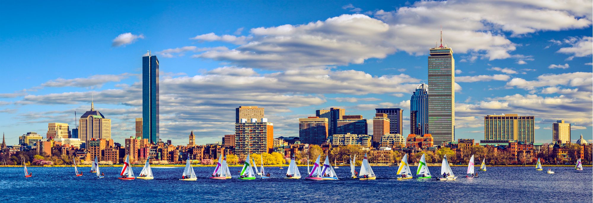 Boston skyline from the Charles River with sailboats
